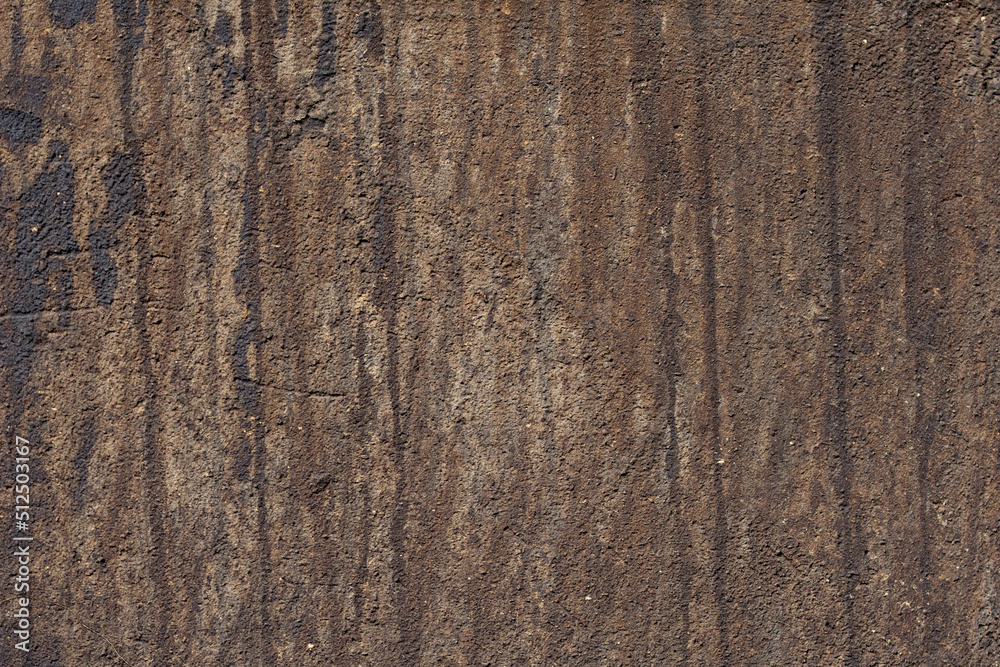 The texture of an old dirty dark-colored wall The texture of an old dirty dark-colored wall