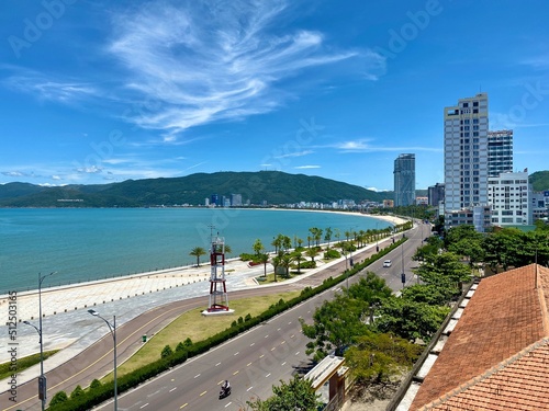 View of Quy Nhon city with a beautiful beach, long coastal route, clear blue sky, and high-rise hotels. Vietnam. Beautiful scenery in Vietnam