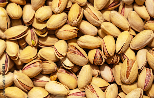 Pistachios in the shell, not peeled, snack. Texture close-up