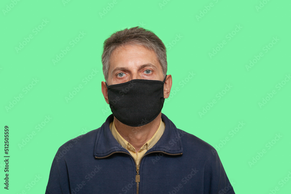 Man in black mask isolated on green screen background.. Man in black mask isolated on green screen background..