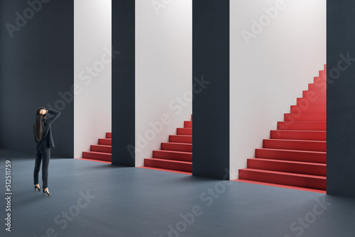  woman standing in abstract concrete interior with question and confusion what entrance with staircase out of three to choose. Direction, success and choice concept. photo