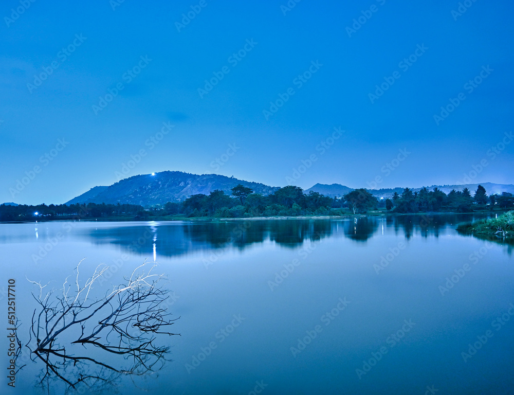 Beautiful dreamy landscape of lake and hill in night time of Bangalore