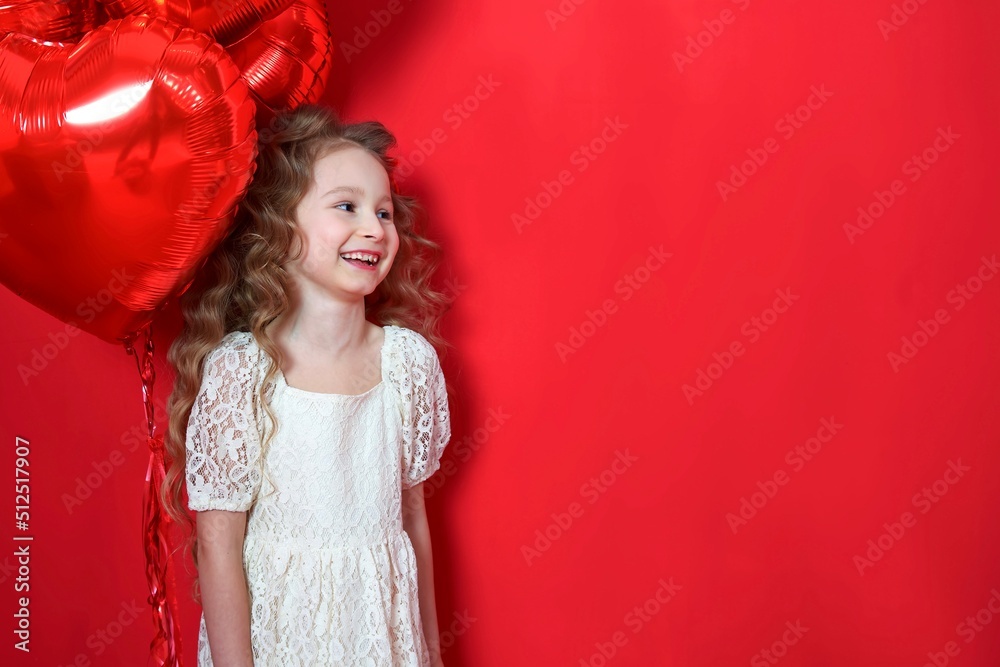 Portrait of happy positive small little kid child girl in dress holding red heart shaped balloons, smiling, celebrating having fun. Saint Valentine’s Day. Present holiday copy space background Portrait of happy positive small little kid child girl in dress holding red heart shaped balloons, smiling, celebrating having fun. Saint Valentine’s Day. Present holiday copy space background