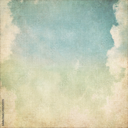 old grunge background canvas paper texture with blue sky and white clouds abstract scenery photo