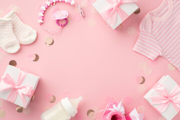 Baby girl concept. Top view photo of gift boxes shirt socks milk bottle booties pacifier chain and shiny confetti on isolated pastel pink background with empty space in the middle