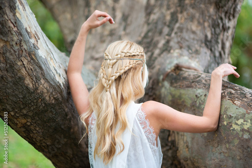 blonde woman in a white dress, with a chic hairstyle