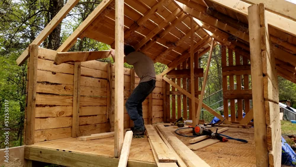 Inside of the chicken coop or house while being build by man. Inside of the chicken coop or house while being build by man.