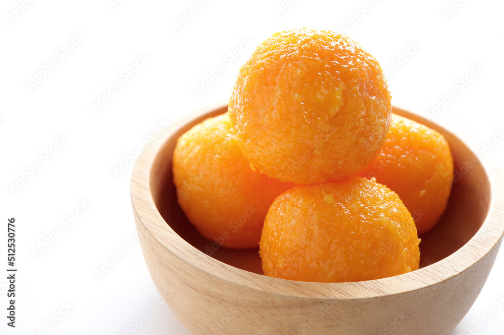 Close up of Indian sweet Motichoor Laddoo or Bundi Laddu. indian sweets fresh ladoo in a wooden bolw. empty space for text, selective focus. Close up of Indian sweet Motichoor Laddoo or Bundi Laddu. indian sweets fresh ladoo in a wooden bolw. empty space for text, selective focus.