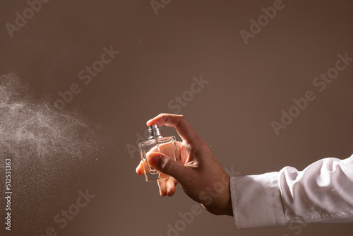 hand holding a spray can. Man perfume bottle. Aroma. background. Fashion. 