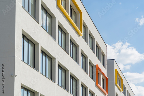 Fragment of modern building facade exterior with blue sky background