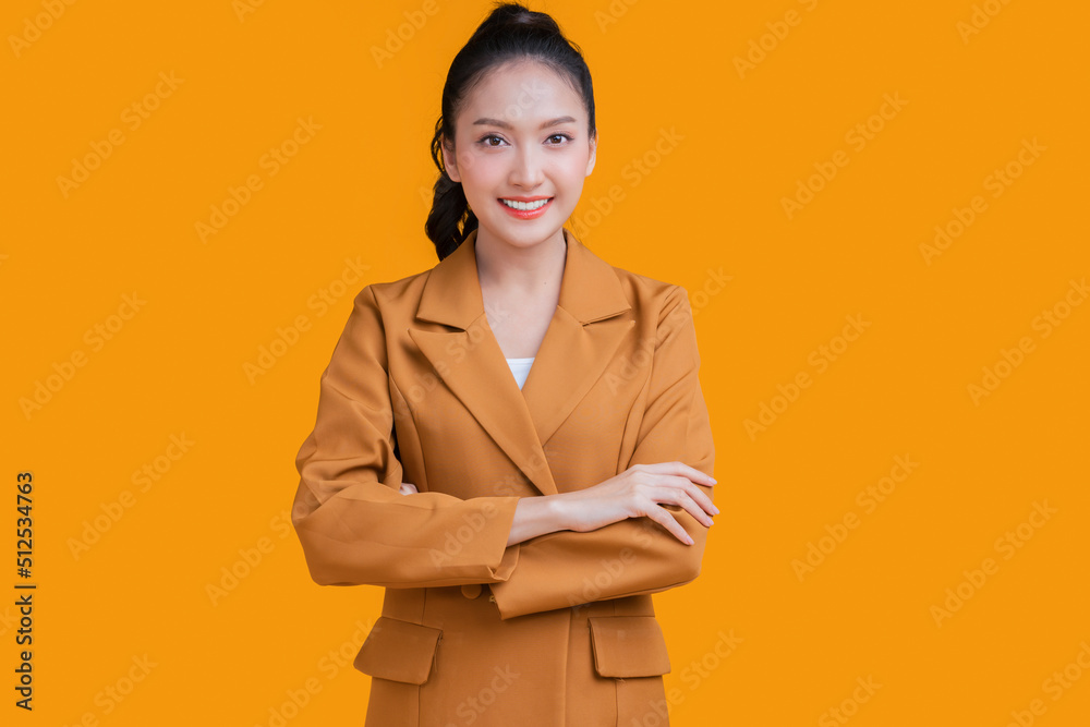Asian business woman female formal cloth smiling hand chest smile with confident and cheerful face expression,asian woman standing studio shot look at camera on yellow background color Asian business woman female formal cloth smiling hand chest smile with confident and cheerful face expression,asian woman standing studio shot look at camera on yellow background color