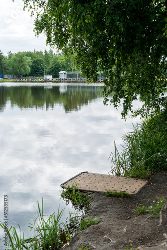 Fotografie, Tablou Place on the pond where you can sit by the water