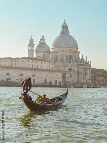 Gondolier rowing on the Grand Canal in winter, Venice, Italy