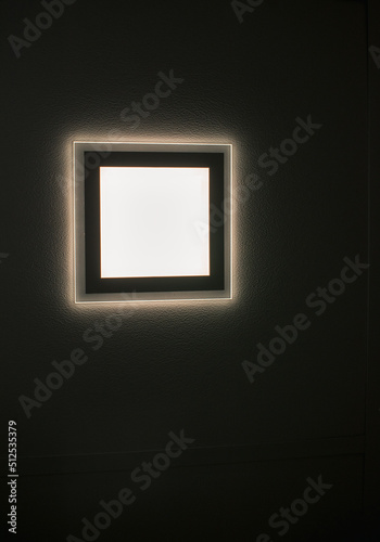 An electric heater hangs on the wall. Space for inscription. Quality image for your project