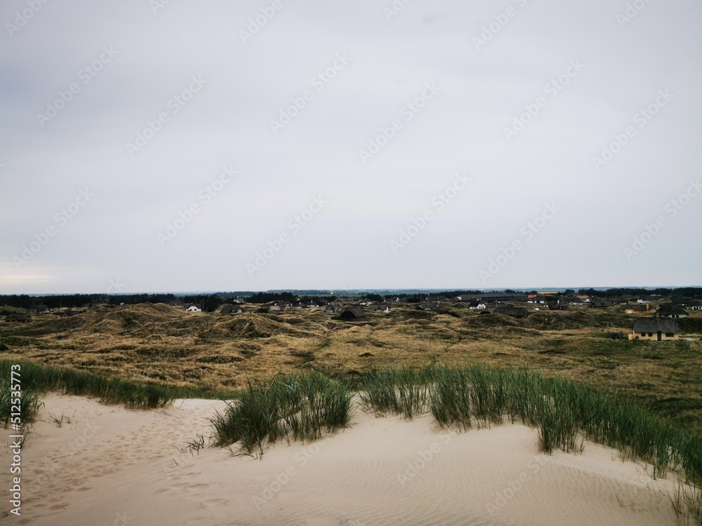 Danish beach scene, Beach and waves, Dunes in the Denmark, Danish North Sea coast Danish beach scene, Beach and waves, Dunes in the Denmark, Danish North Sea coast