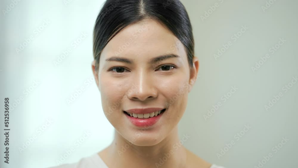 Portrait happy moment of young woman look at camera. Close up beautiful lady smiling slow motion shots. Portrait happy moment of young woman look at camera. Close up beautiful lady smiling slow motion shots.