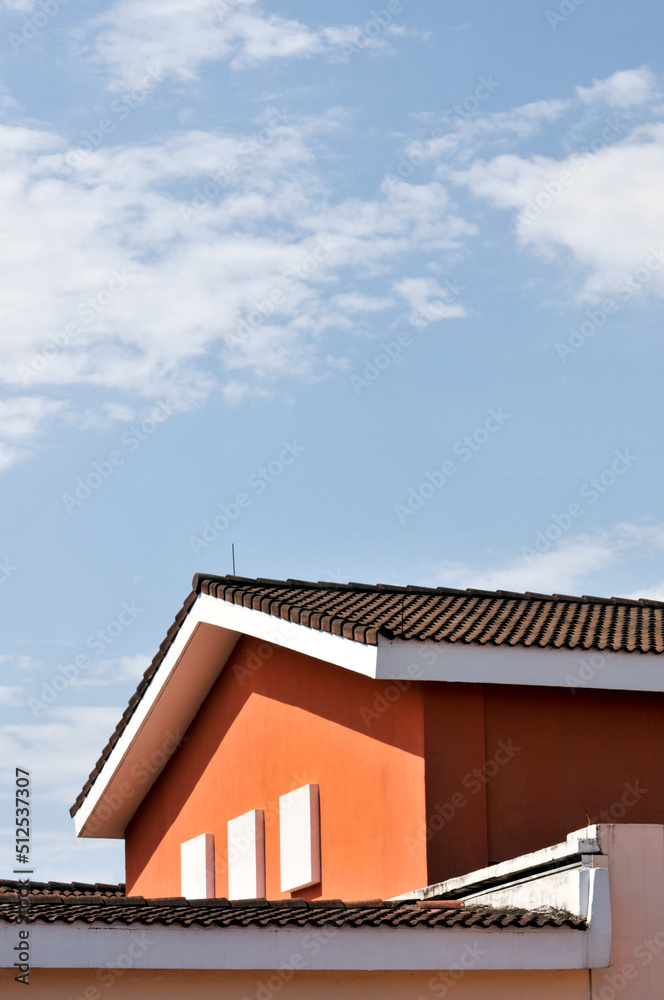 closeup of roof of a house in blue sky