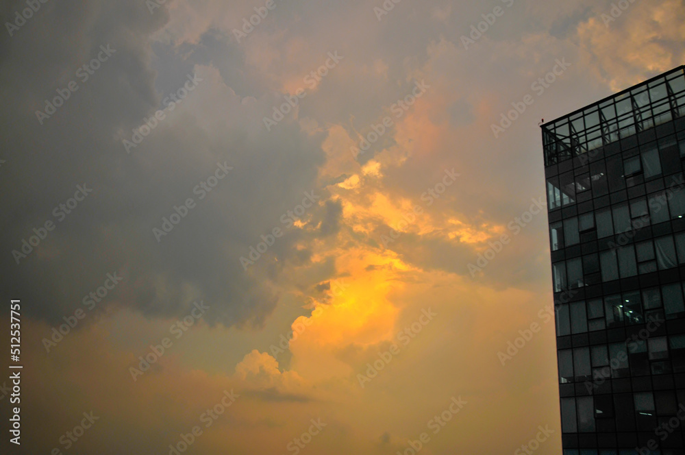 building with clouds building with clouds