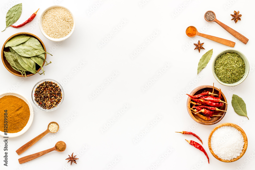 Assortment of cooking flavor - spices and herbs in bowls, top view Assortment of cooking flavor - spices and herbs in bowls, top view