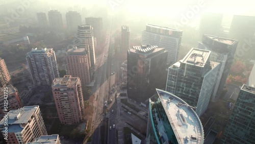 Aerial view dolly in of Alonso de Cordova street, in the municipality of Las Condes, residential buildings, Santiago, Chile. photo