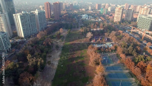 Aerial view dolly in the Parque Araucano in Las Condes, Santiago, Chile. Surrounding buildings photo