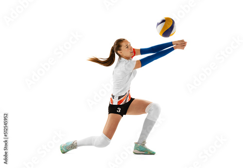 Female professional volleyball player in sports uniform training with ball isolated on white background. Action, sport, healthy lifestyle, team, fitness concept