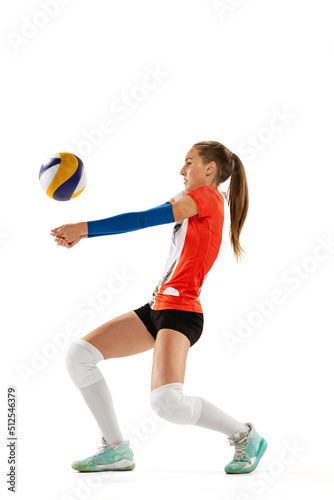 Female professional volleyball player in sports uniform training with ball isolated on white background. Action, sport, healthy lifestyle, team, fitness concept © master1305