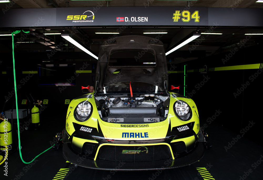Box 3 Racing Porsche 911 GT3 racing super car in box circuit, open hood.and visible ...