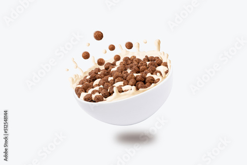 breakfast snacks fall into bowl with milk. File contains clipping path
