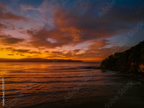 Winter sunrise at the seaside with high cloud and reflections