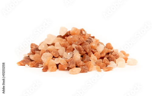 Himalayan pink salt close-up on a white background flat lay. Dry herbs as seasoning. Indian and Arabic spices for cooking. Medicinal herbs and condiment.