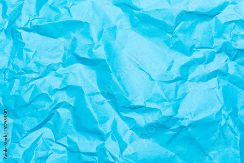textured background of crumpled blue paper