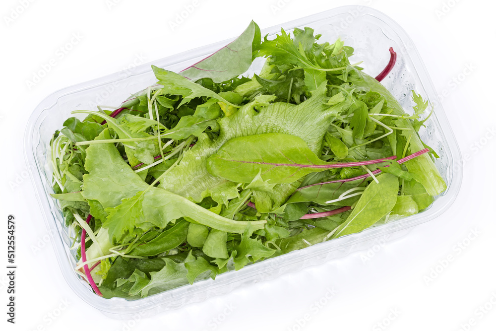 Mix of fresh greens in plastic container on white background Mix of fresh greens in plastic container on white background