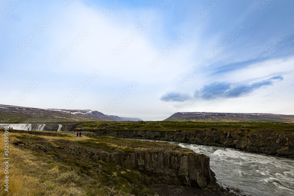 A river flow coming out of Godafoss waterfalls in northern Iceland.