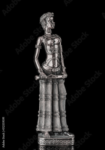 African woman statue isolated on black