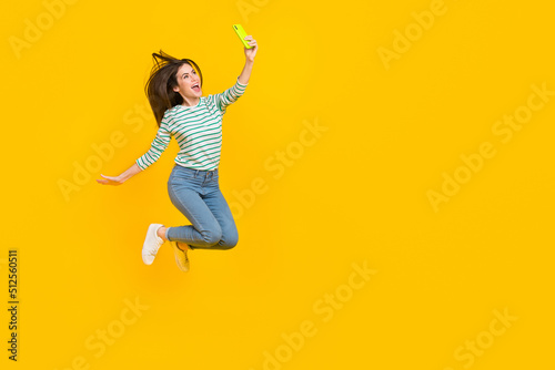 Full size photo of casual wear girl take selfie make photo for her blog new post isolated on yellow color background