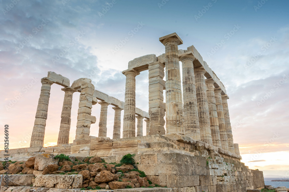 The Temple of Poseidon at Cape Sounion at sunset, over the Aegean Sea, Greece