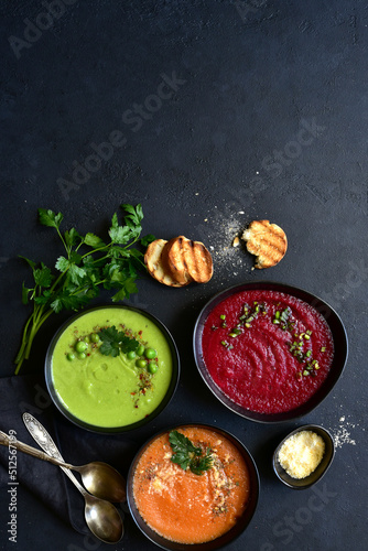 Different types of vegetable soups. Top view with copy space.