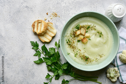 Vegetarian cauliflower cream soup with croutons. Top view with copy space.