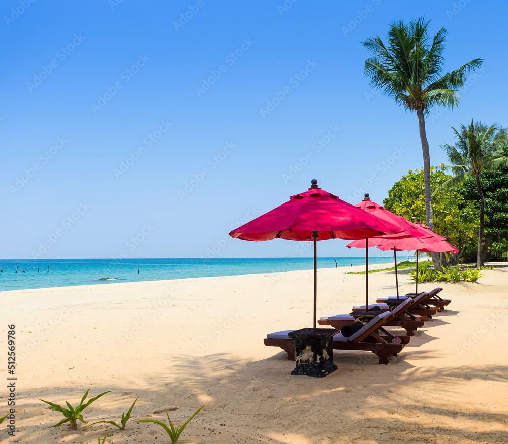 Relaxing by the beach, red umbrella with beach chair on tropical island, summer holiday destination to Asia, tropical island in south of Thailand