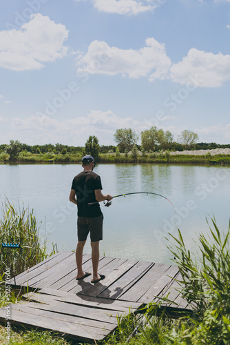 A man fishes from the pier