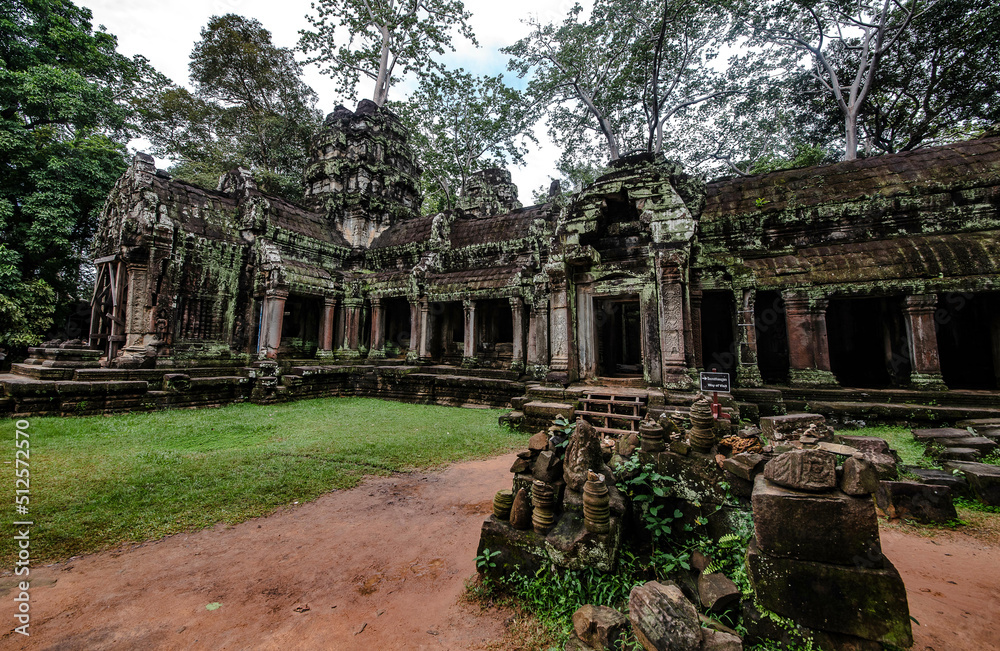 An ancient sandstone building that forms a walkway around the Ta Prohm temple at Angkor Wat. Siem Reap Cambodia