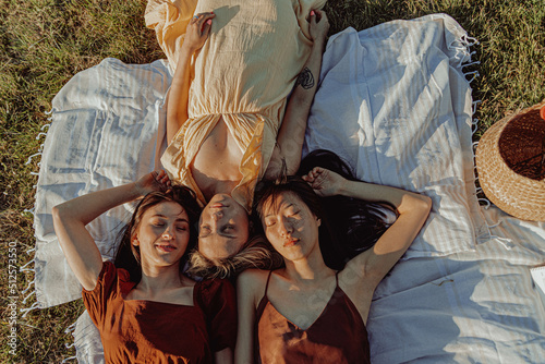 HAPPY GIRLS STUDYING TOGETHER IN THE COUNTRYSIDE.  photo