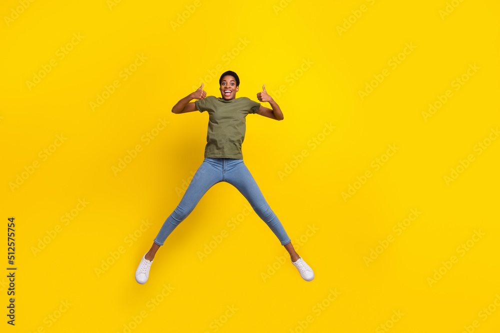 Full body portrait of energetic person show thumb up gender equality isolated on yellow color background
