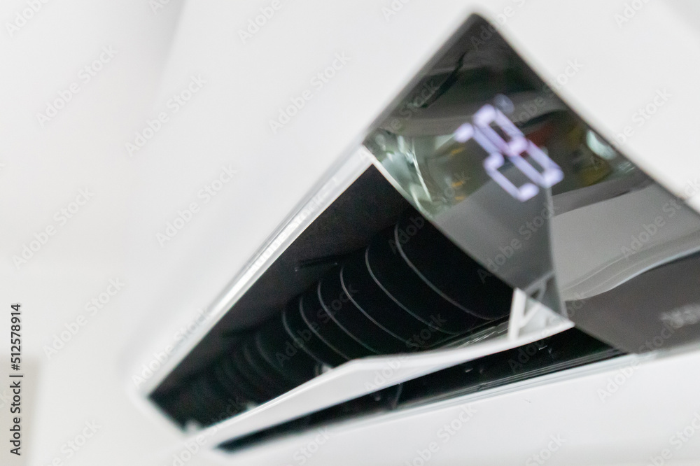 Air conditioner on white wall room interior background Air conditioner on white wall room interior background