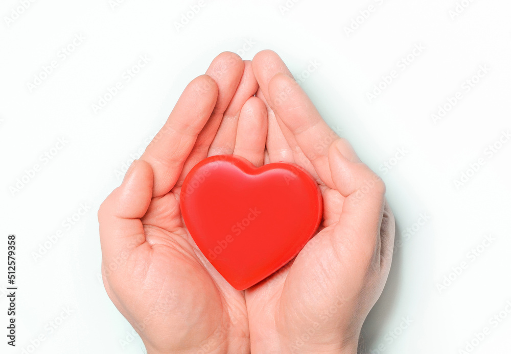 Red heart in hands on white background. Healthcare and hospital medical concept,organ donation concept.Symbolic of Valentine day.Heart day.Сopy space.