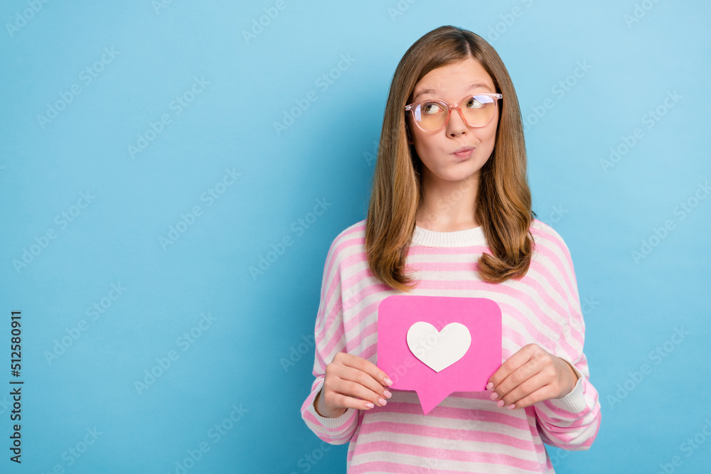 Photo of minded hesitate person look interested empty space isolated on blue color background Photo of minded hesitate person look interested empty space isolated on blue color background
