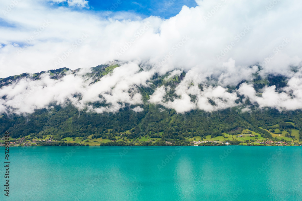 View of Brienz lake and the mountains covered with clouds