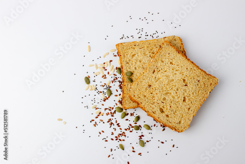Tableau sur toile Healthy tasty multigrain bread with pumpkin, chia, flax seeds on white backgroun