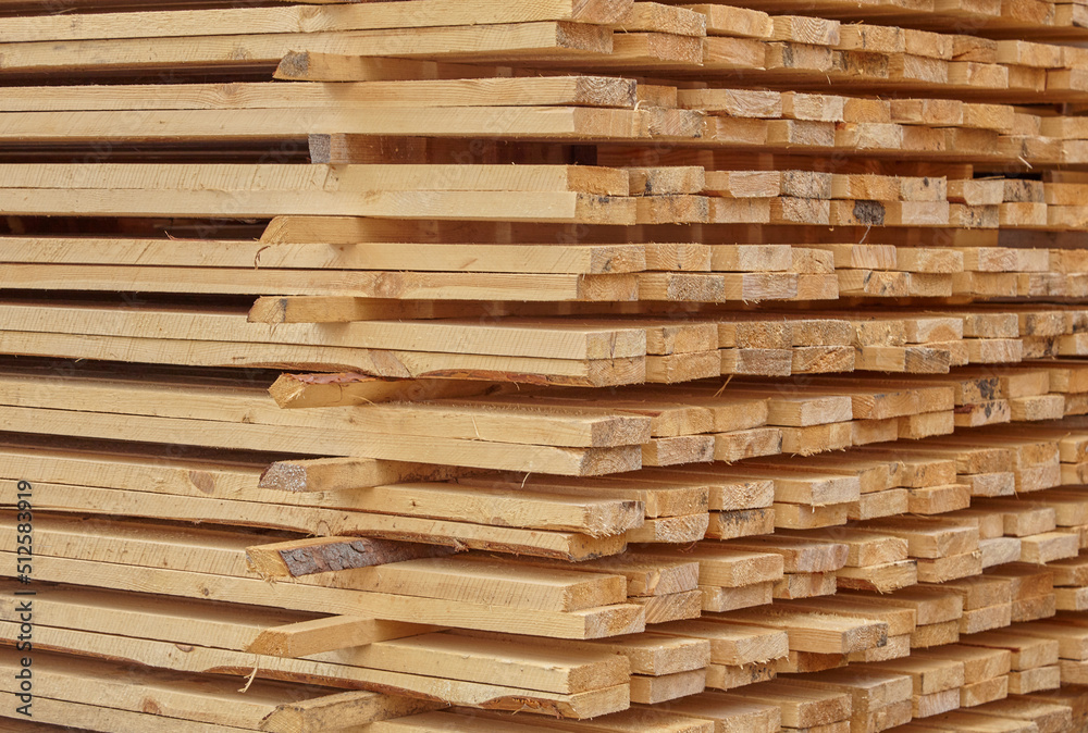 Edged board in stacks. Natural background. Texture. Edged board in stacks. Natural background. Texture.